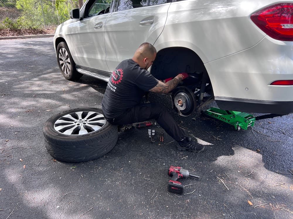 Cumba's technician working on a vehicle wheel on-site